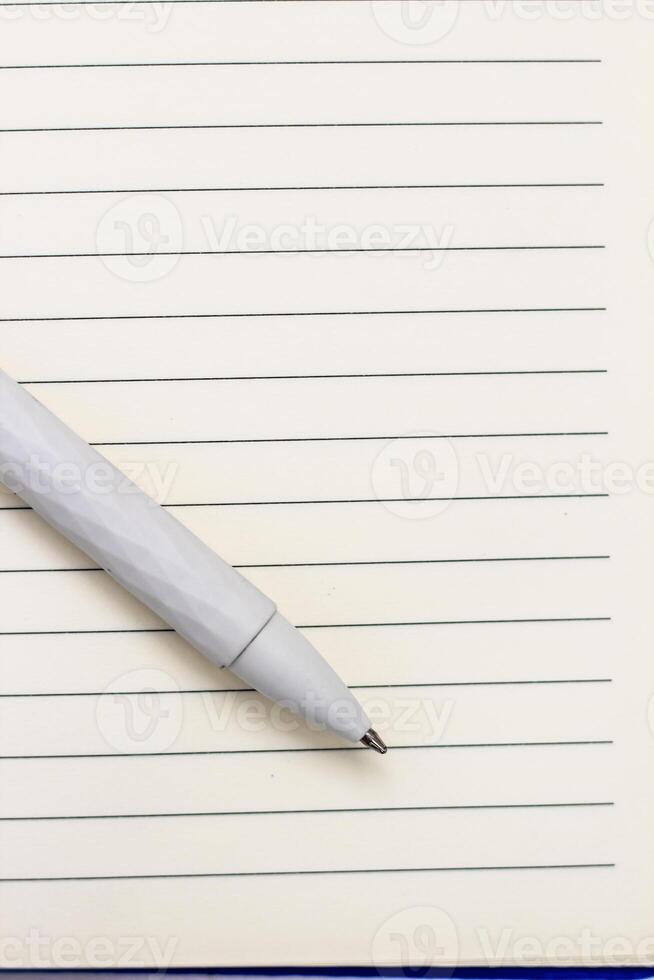 The pen lies in the notebook, the concept of study, time management. photo