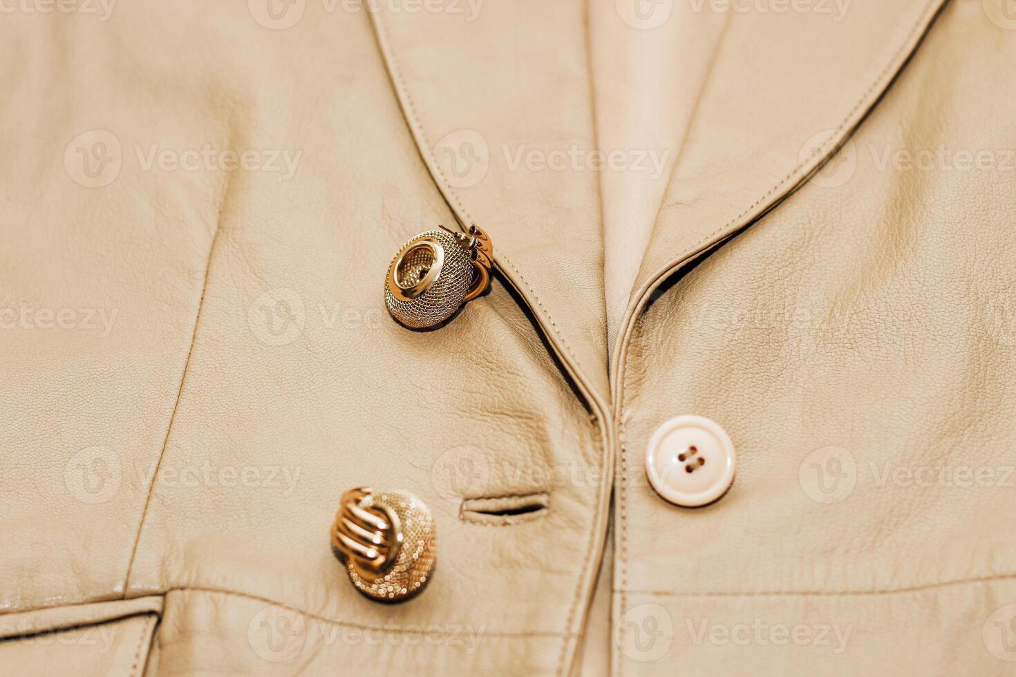 Decoration on the texture of a brown leather jacket, genuine soft leather photo