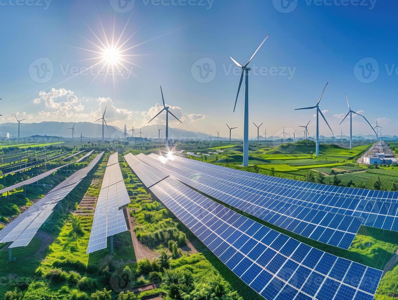 Panoramic View of an Eco-Friendly Power Plant with Solar Panels and Wind Turbines photo