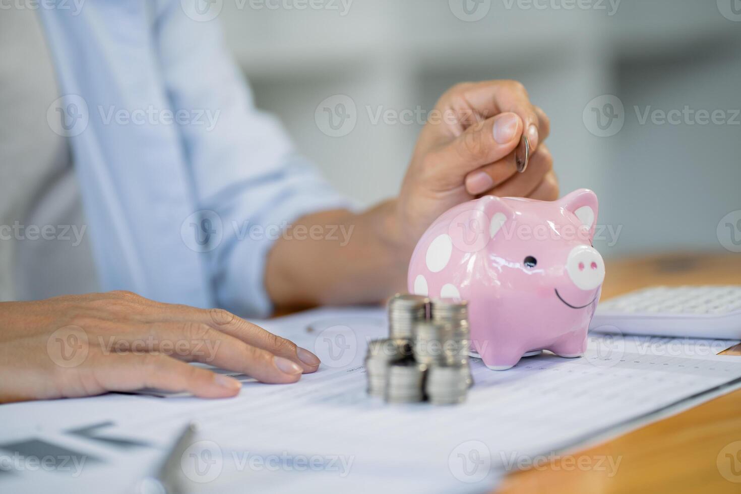 Saving money. Businessman Accountant verify growing business and saving money stacking coins with calculator. Accountancy Concept. photo