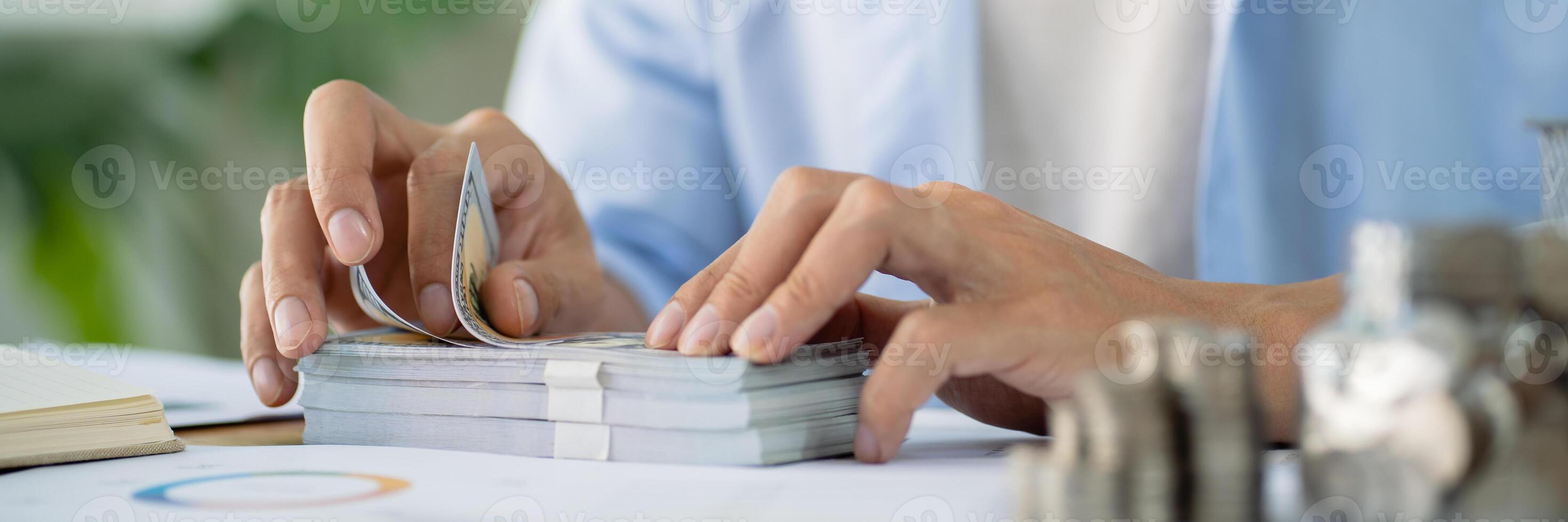 Saving money. Businessman Accountant verify growing business and saving money stacking coins with calculator. Accountancy Concept. photo