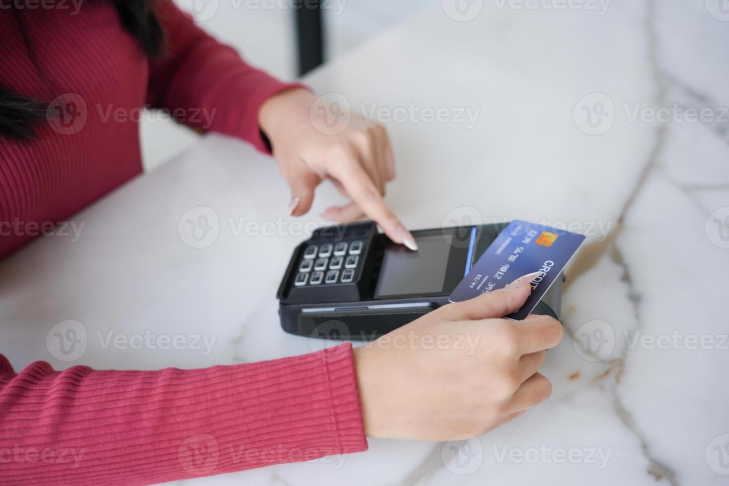 Contactless payment holding credit card with touch settlement paying for shopping nfc technology transaction cashless technology and credit card payment photo