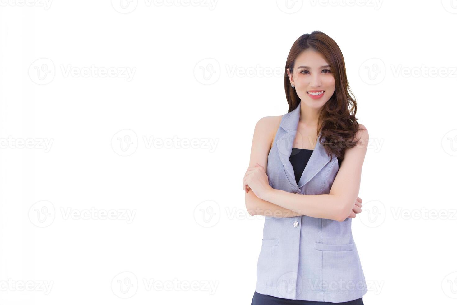 Young asian professional confident working woman who has long hair is standing confidently and arm crossing while isolated white background. photo