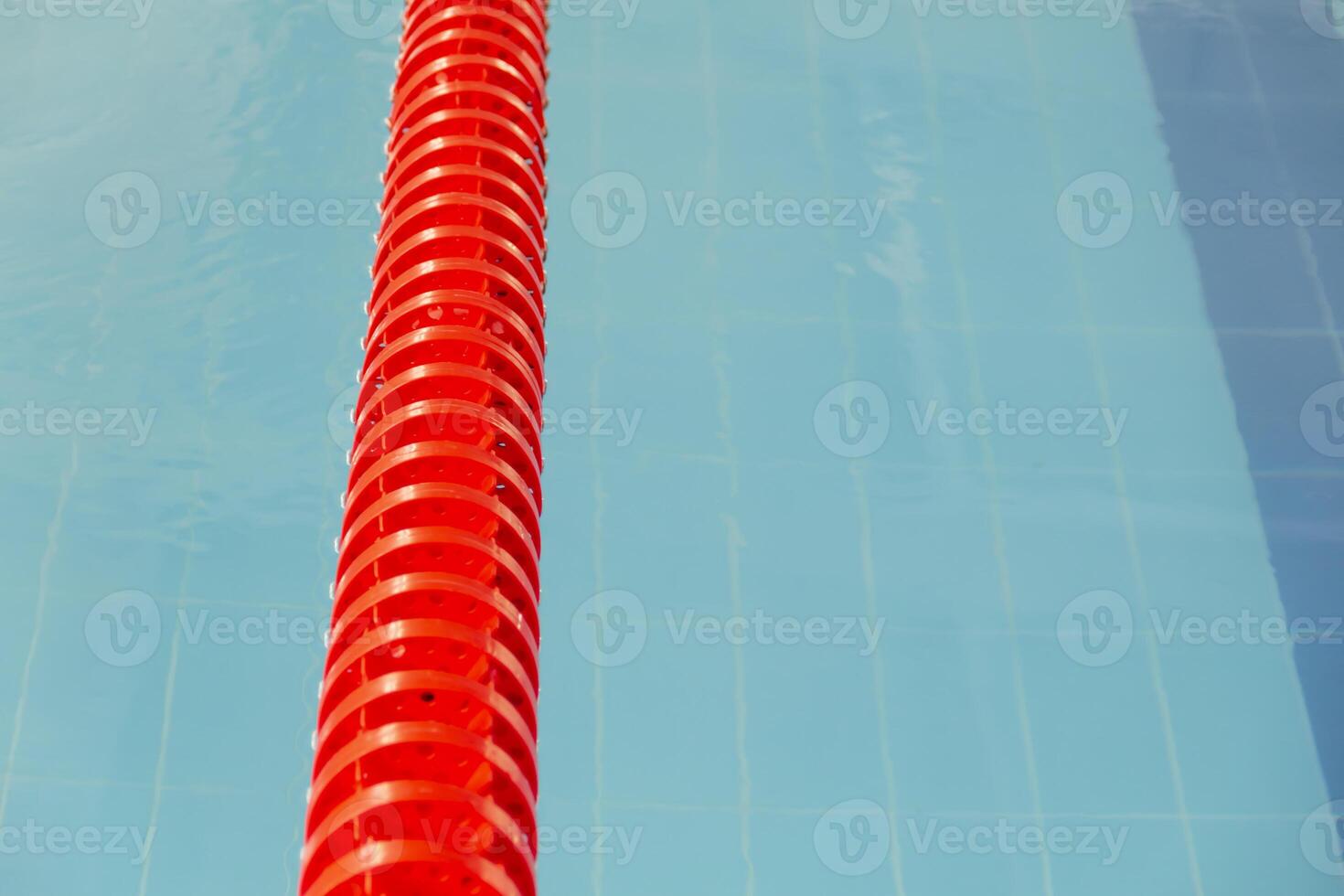 Swimming pool with clear water on a bright sunny day while on vacation and travel. photo