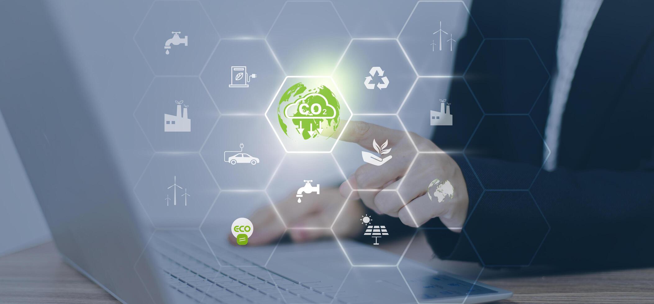 CO2 emission reduction concept.world icon in hand with environmental icons, Ideas for Sustainable development, and green business based on renewable energy. Energy saving, Sustainable development. photo