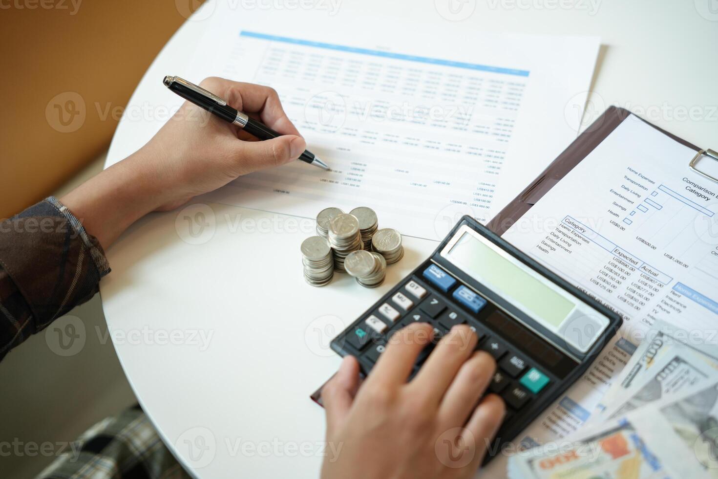 Saving money. Businessman Accountant verify growing business and saving money stacking coins with calculator. Accountancy Concept photo