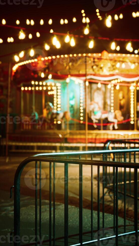 Illuminated Merry Go Round in Abandoned Amusement Park photo