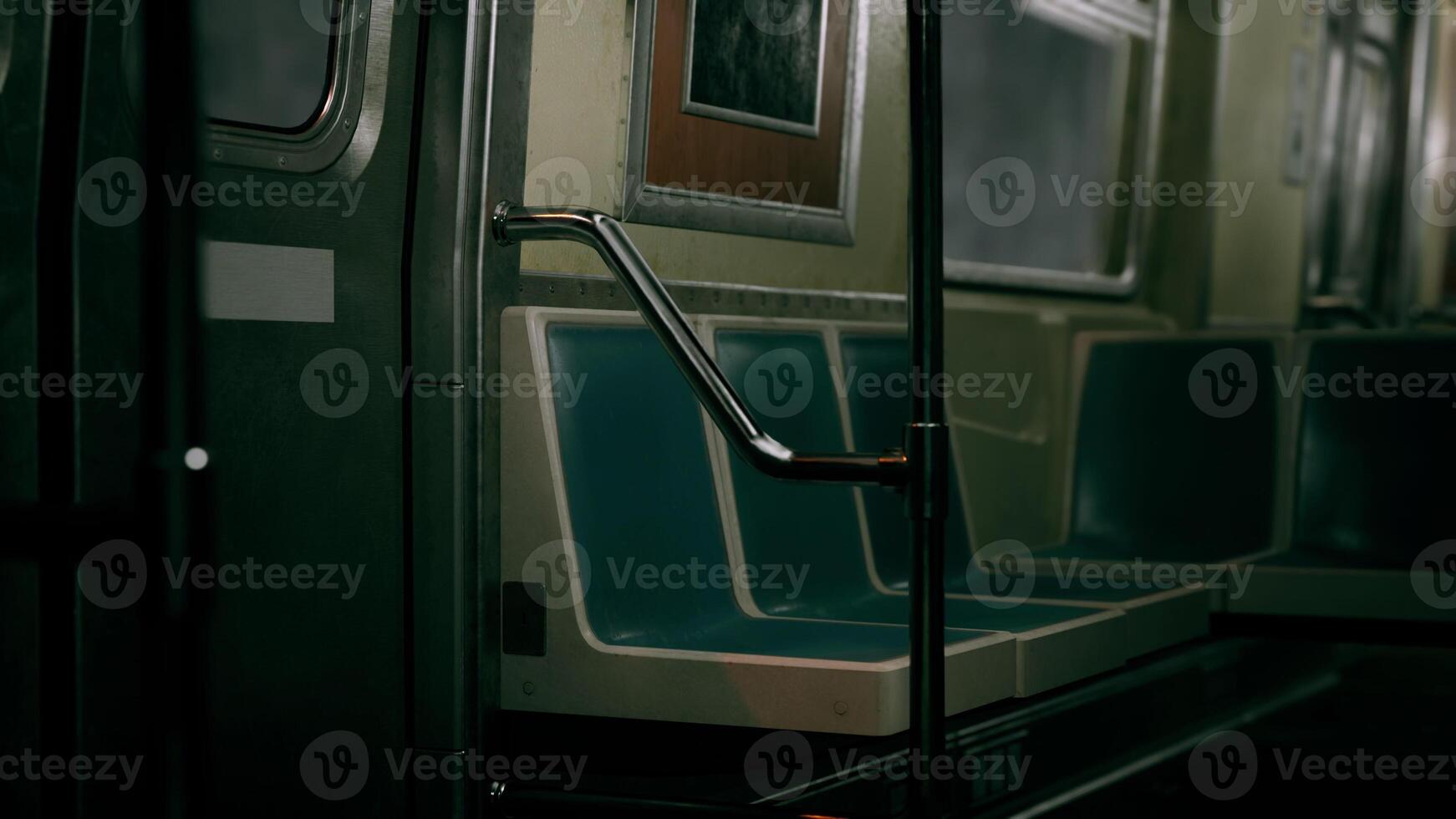Empty Subway Car With Blue Seats and Picture on Wall photo