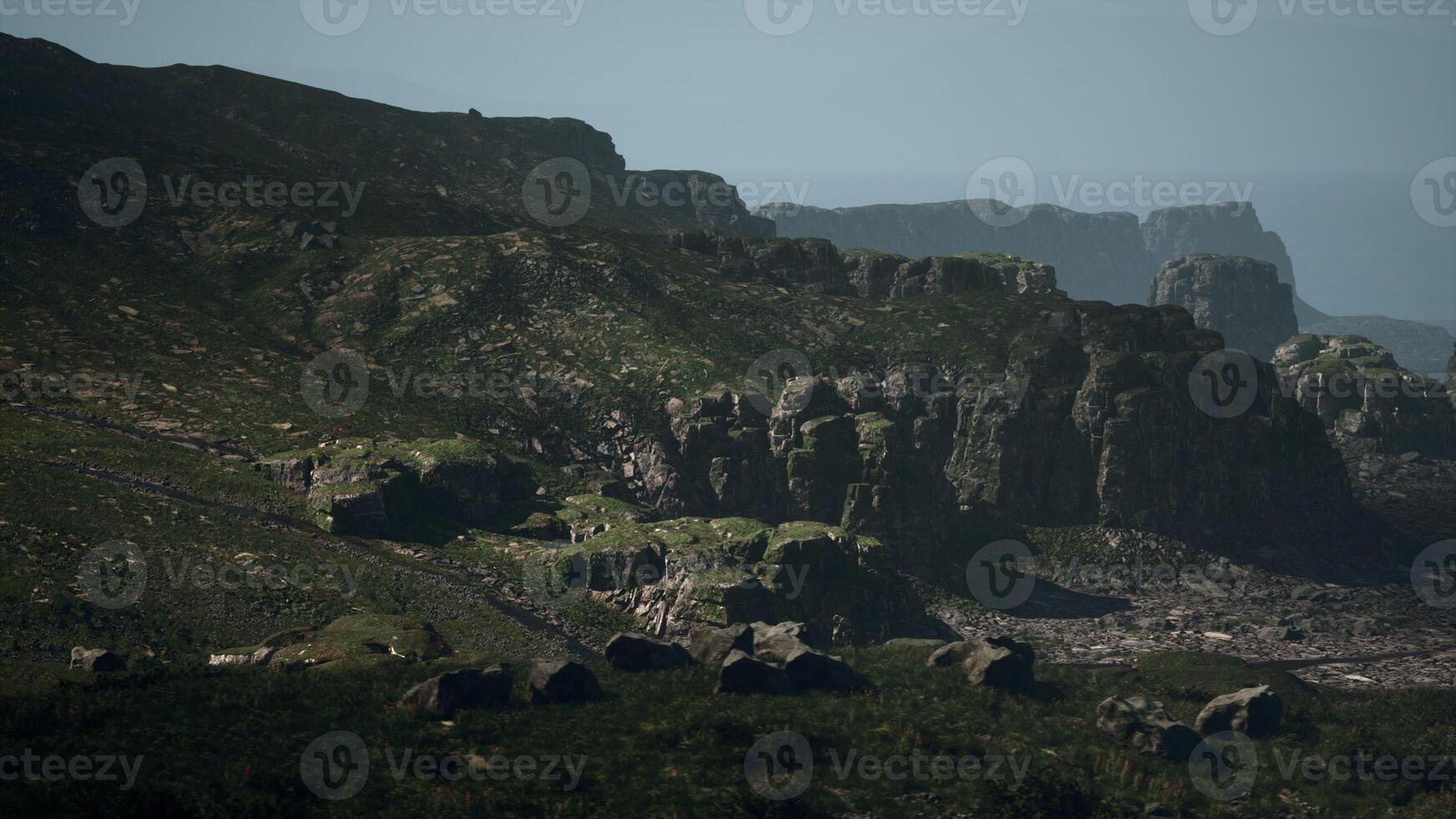 Majestic Mountain Range With Rocks and Grass photo