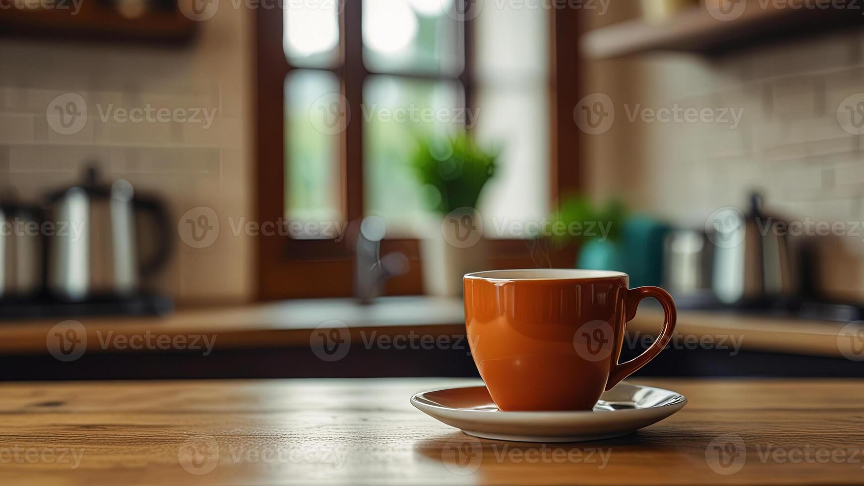 Wooden table top with cup of coffee or tea on blurred kitchen, restaurant or bar interior background with copy space. photo