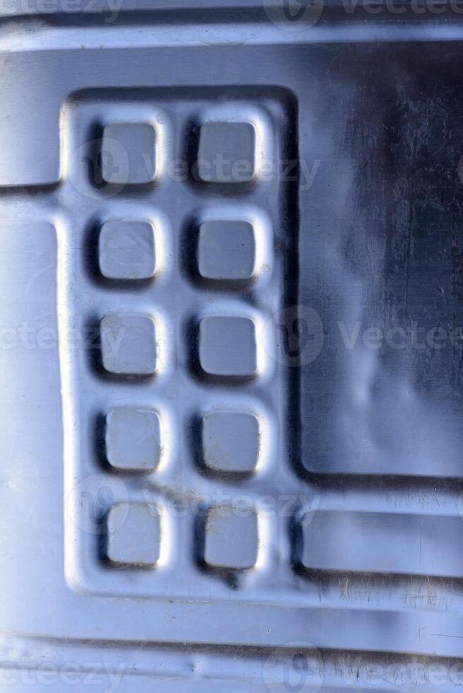 Shiny metal surface. The shiny radiator of an old refrigerator. photo