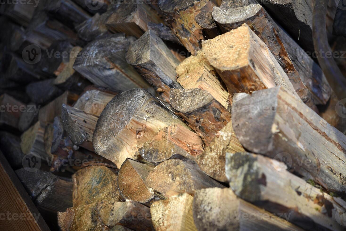 There's firewood in the closet. Stacked firewood. Storage of firewood. photo