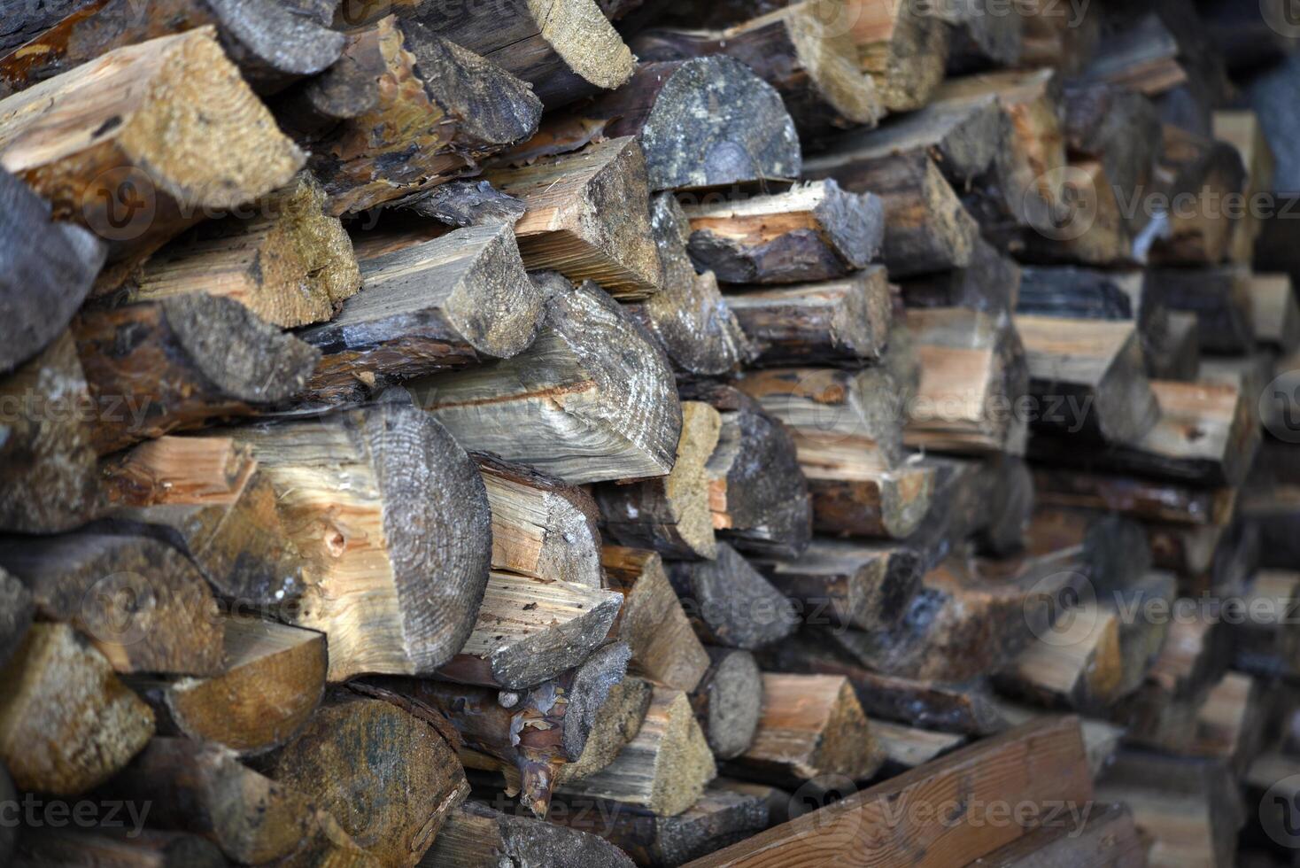 There's firewood in the closet. Stacked firewood. Storage of firewood. photo