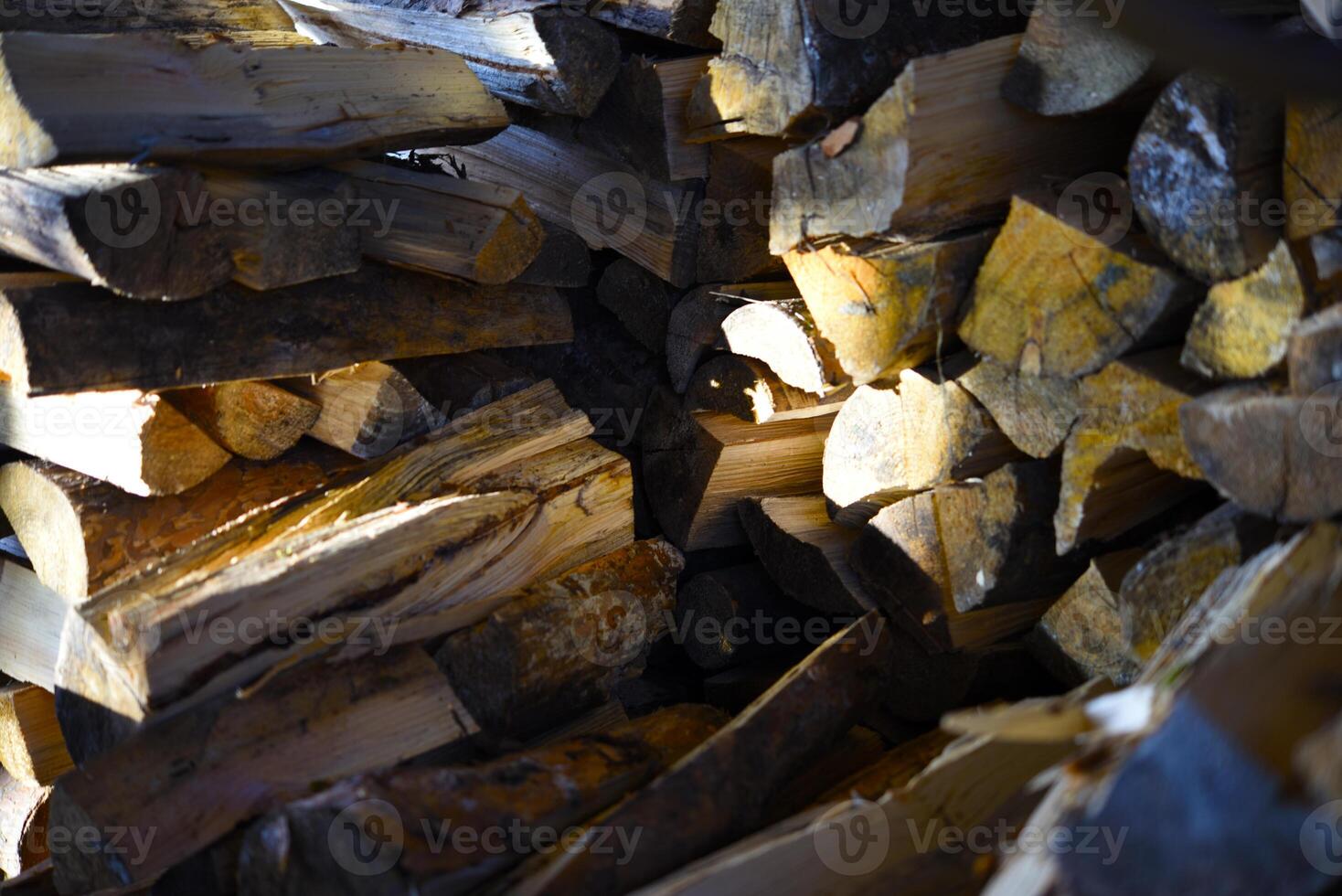 There's firewood in the closet. Stacked firewood. Storage of firewood. photo
