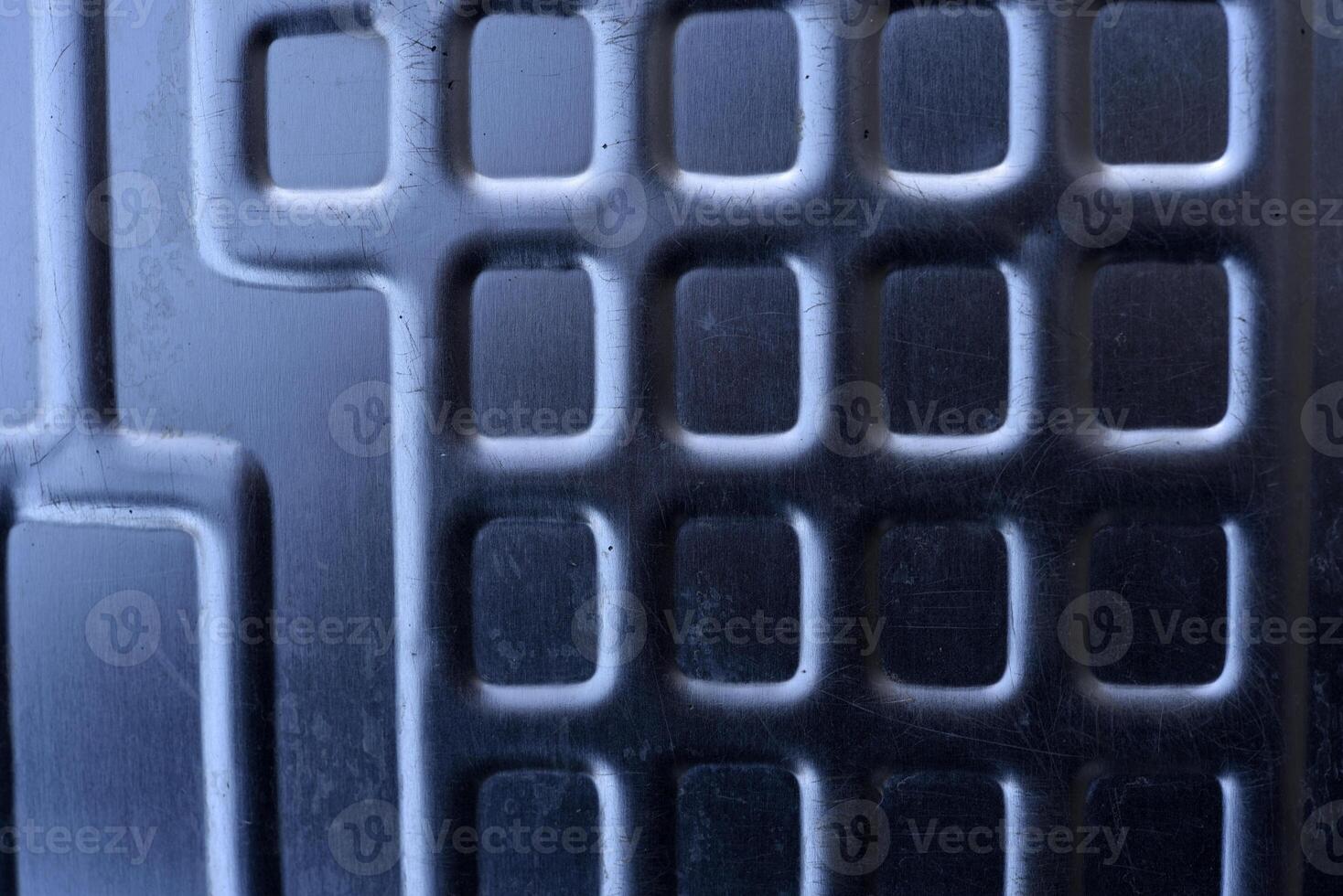 Shiny metal surface. The shiny radiator of an old refrigerator. photo