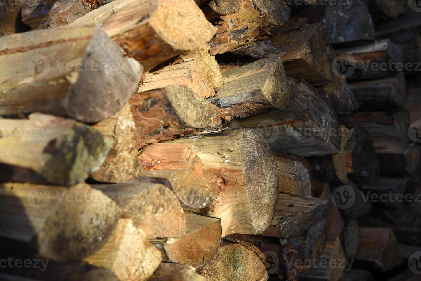 There's firewood in the closet. Stacked firewood. Storage of firewood. photo