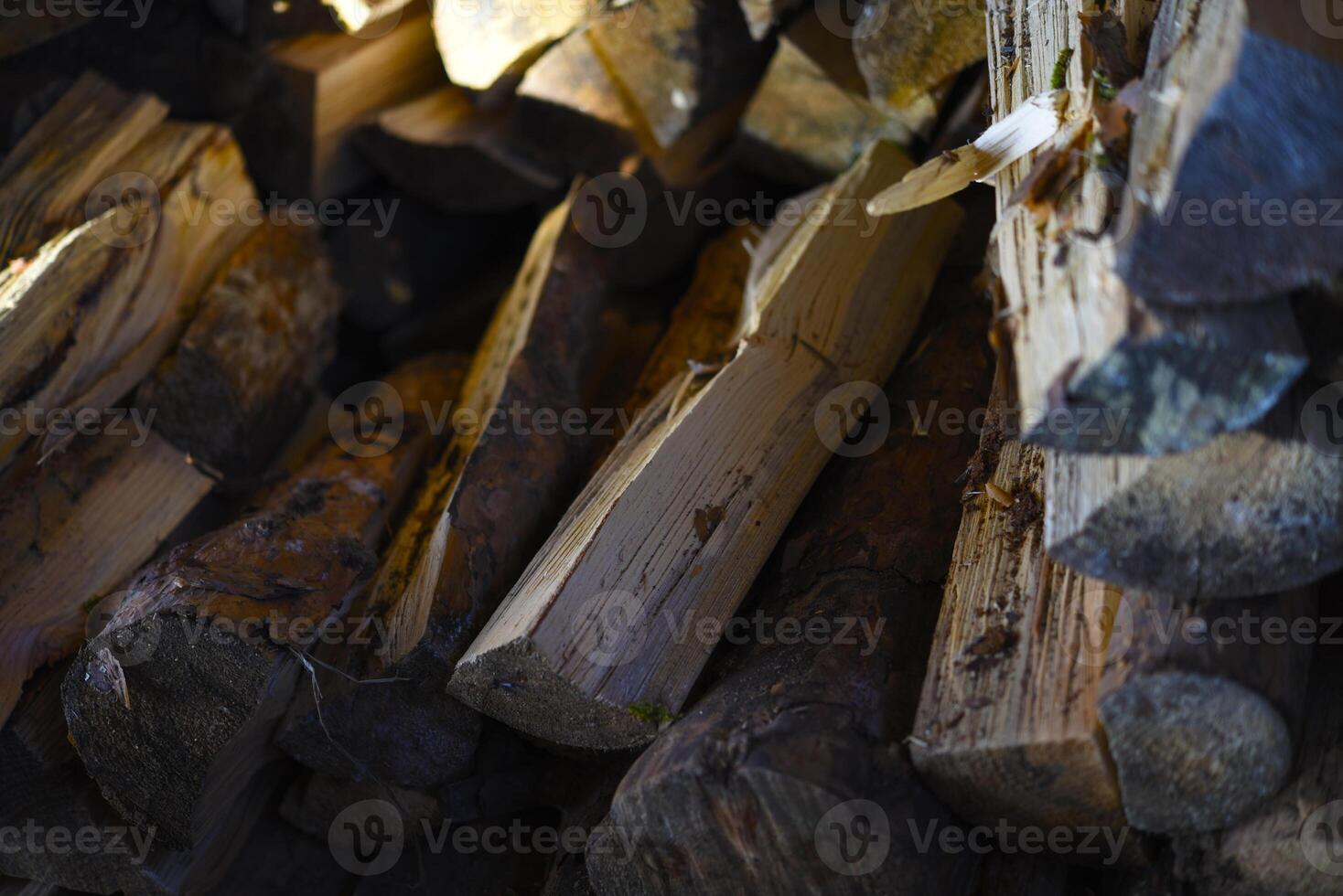 There's firewood in the closet. Stacked firewood. Storage of firewood. photo