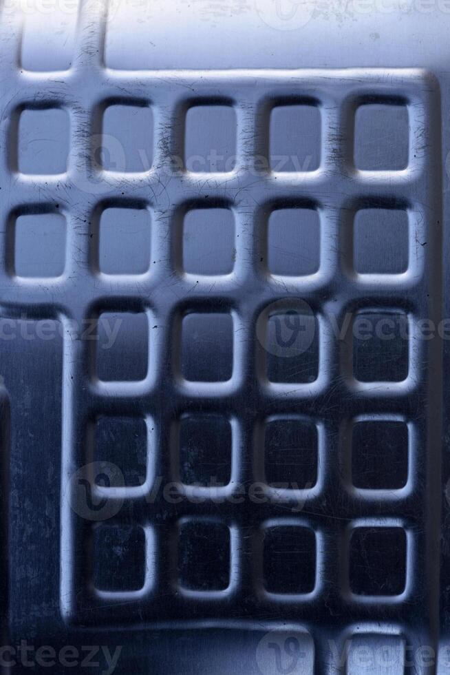Shiny metal surface. The shiny radiator of an old refrigerator. photo