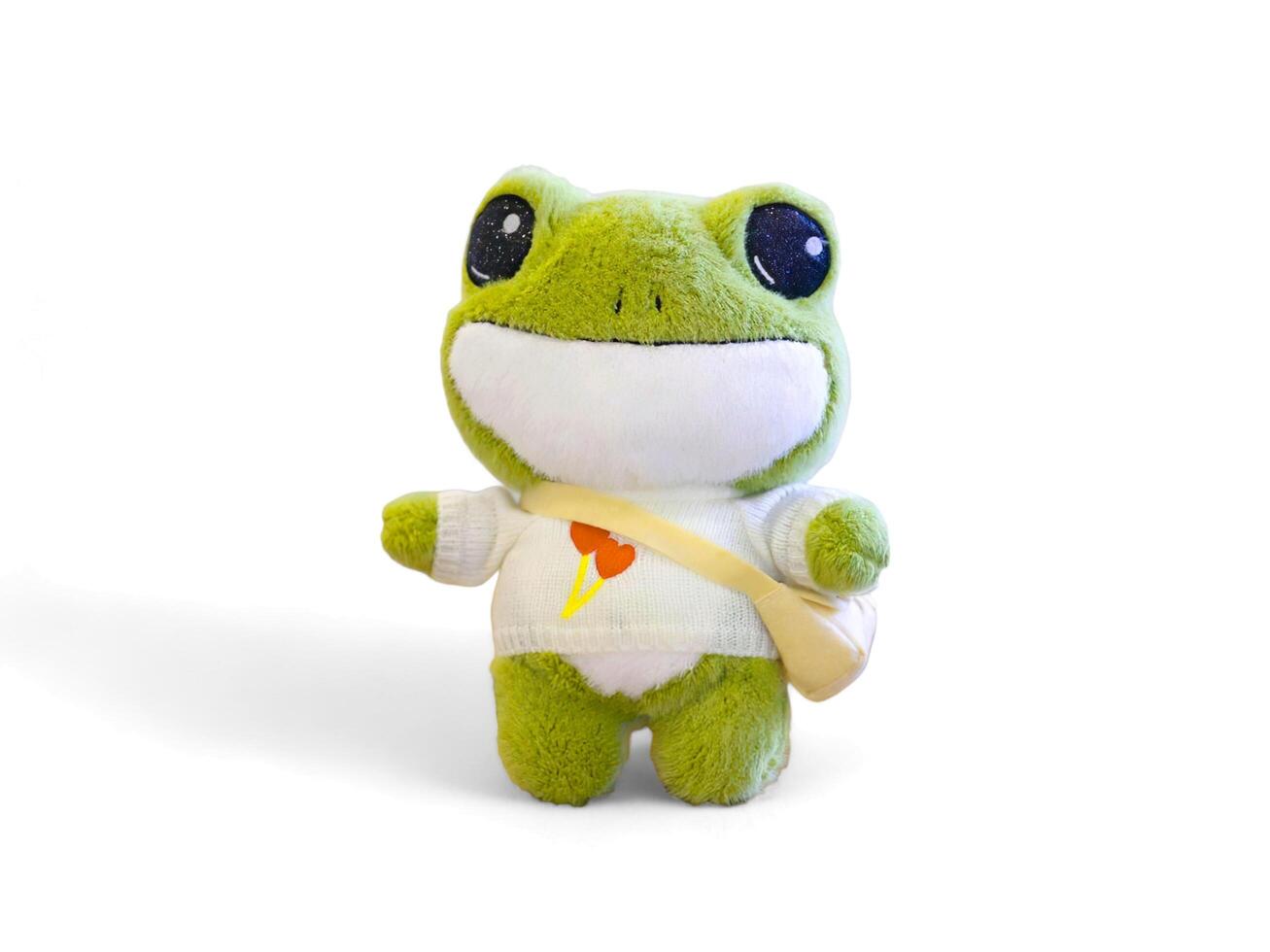 Cute frog doll wearing a bag on a white background photo