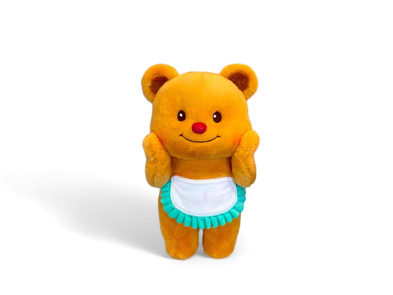 Cute teddy bear wearing an apron on a white background photo