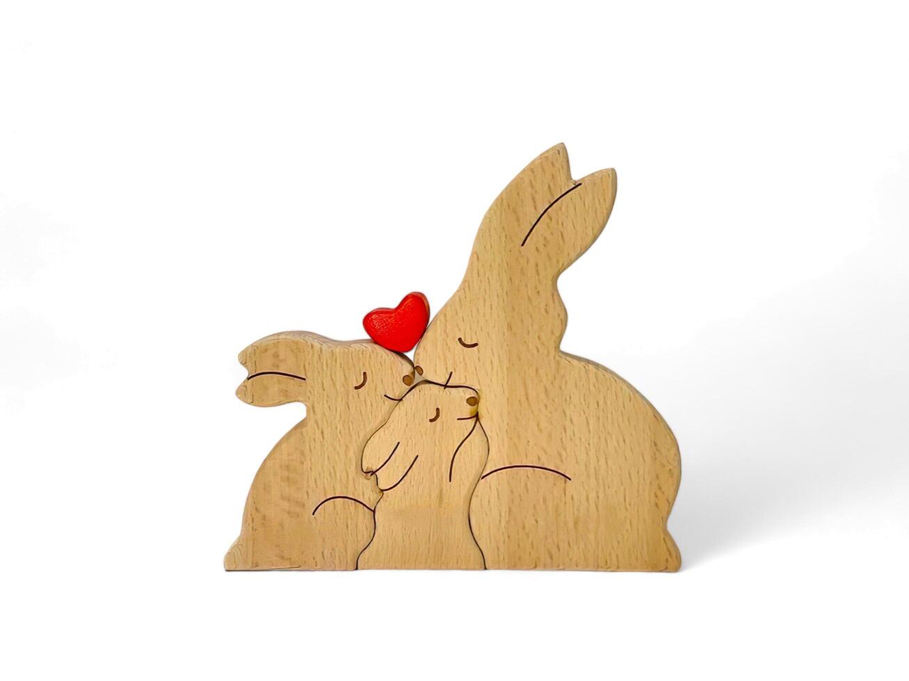 miniature rabbit family decoration made of wood on a white background photo