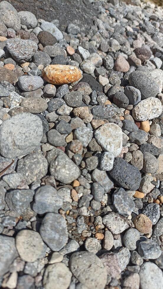 A collection of medium-sized river rocks is usually used as a mixture of building construction materials photo