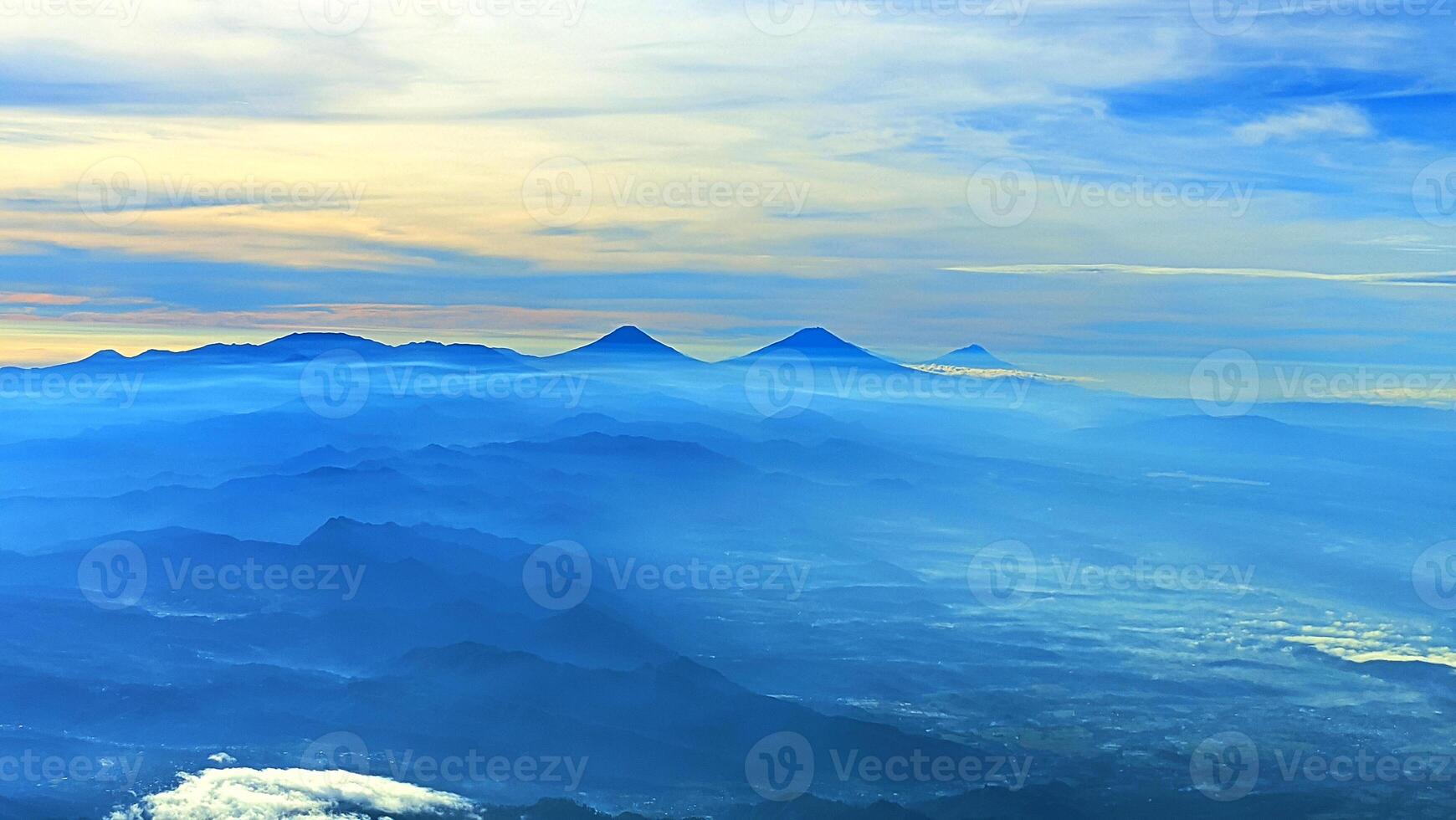 aerial view with mountain background in the morning, view of blue clouds photo