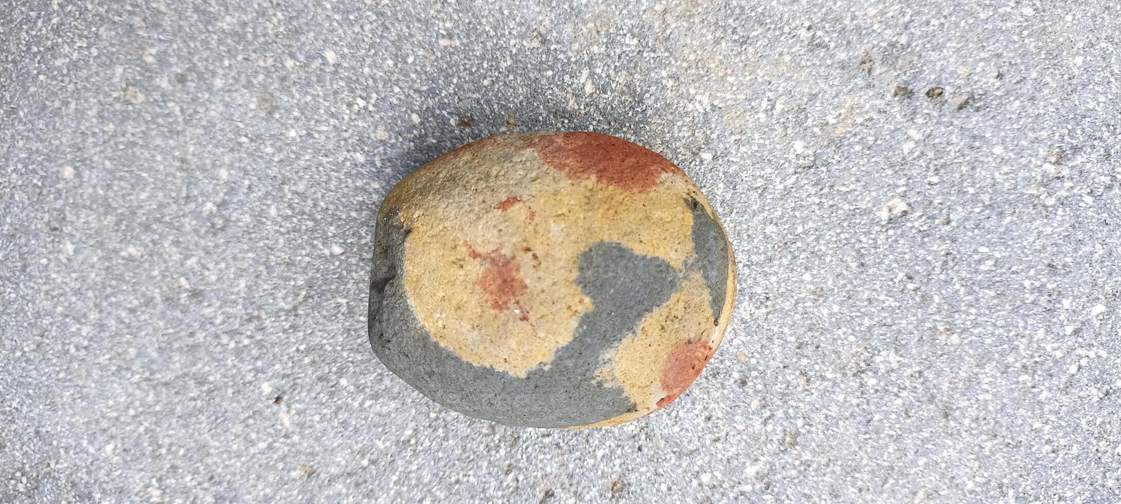 a small stone patterned with gray and light brown colors photo