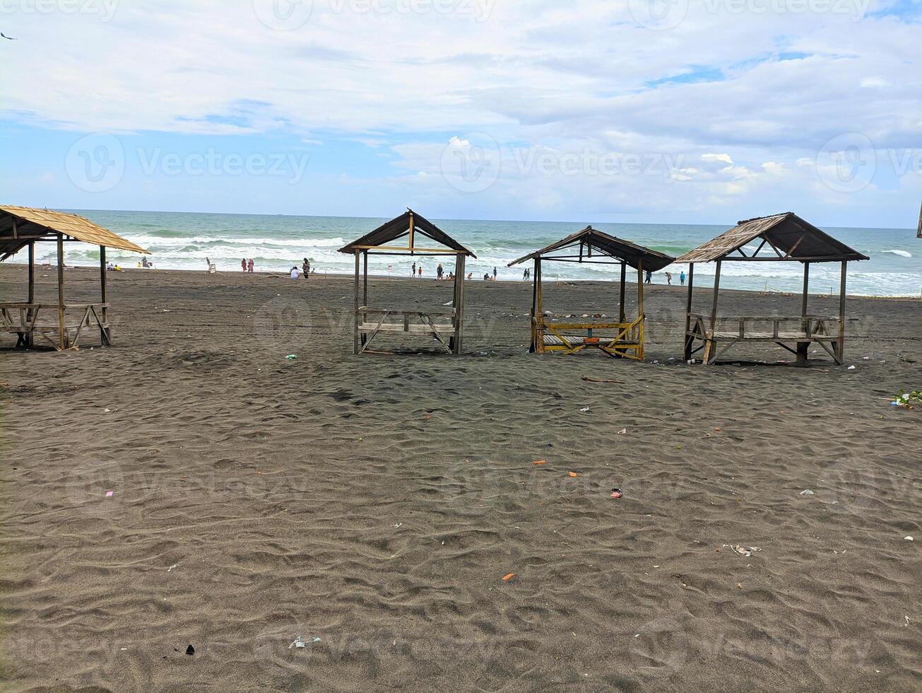 PURWOREJO CENTRAL JAVA INDONESIA APRIL 17 2024 view of Jatimalang beach which is equipped with huts around the beach photo