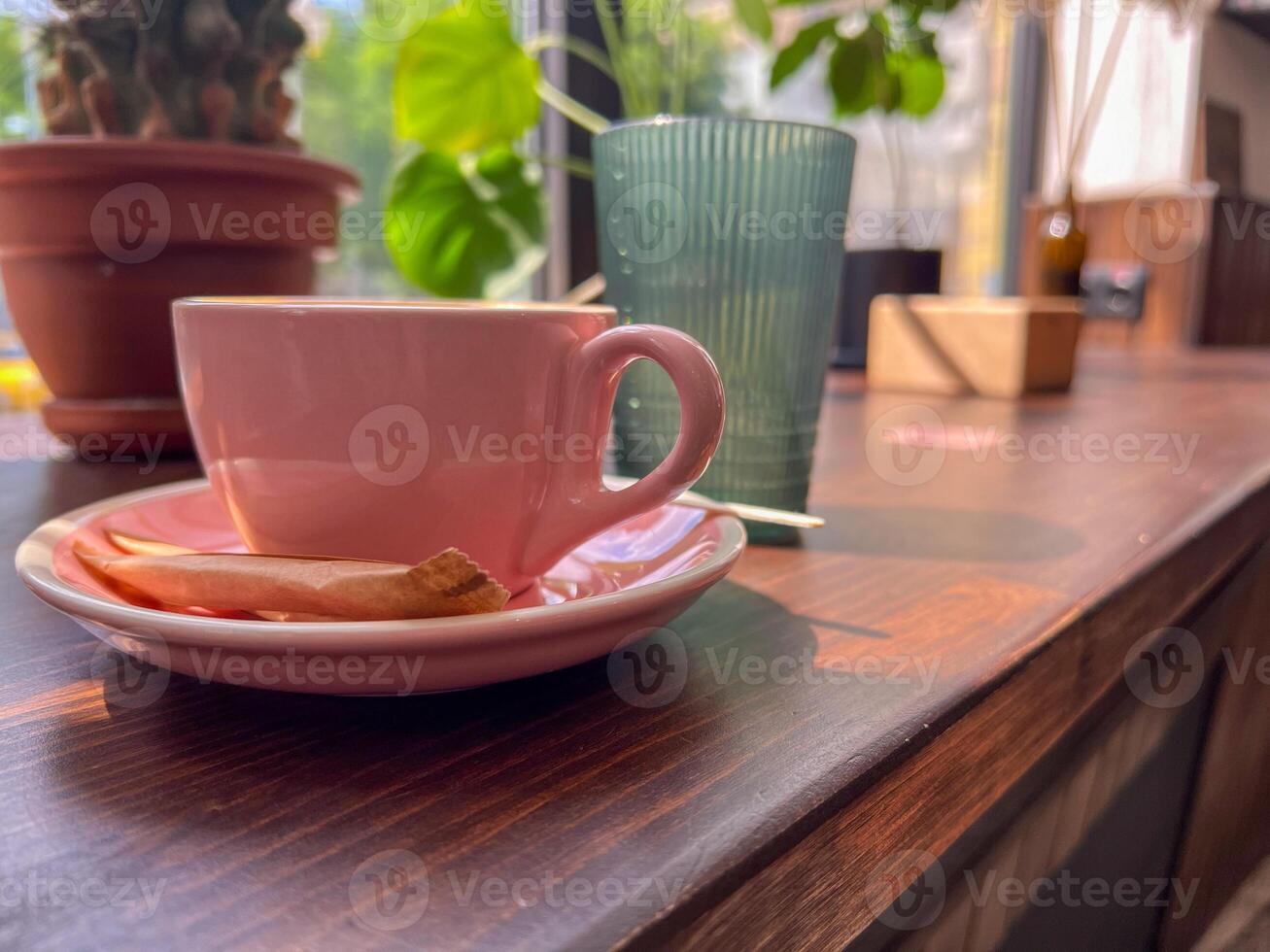 Cappuccino coffee cup at cafe on wooden windowsill photo