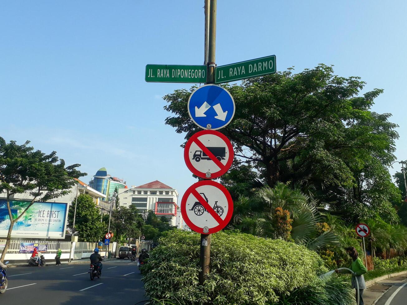 Road sign in Diponegoro and Darmo street in Surabaya, East Java Indonesia. Popular busy road in Surabaya photo