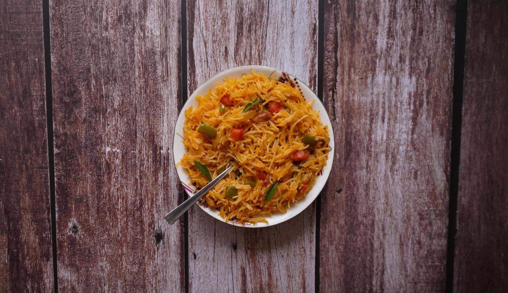 Rustic Vermicelli Upma on Wooden Table photo