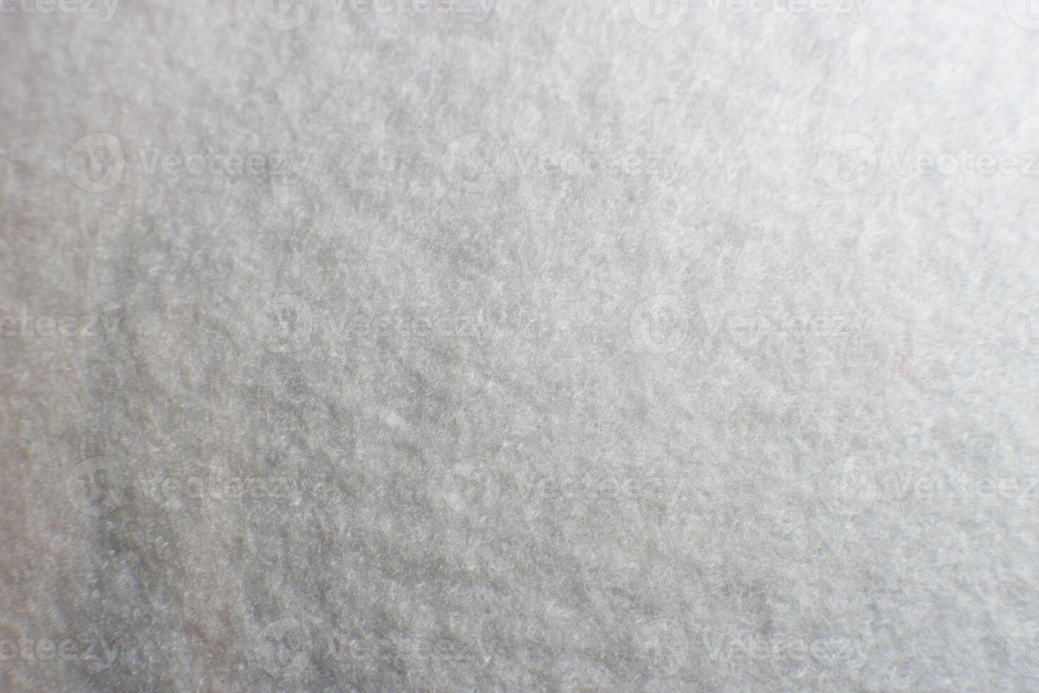 White artificial foam, foam texture on a light background. photo