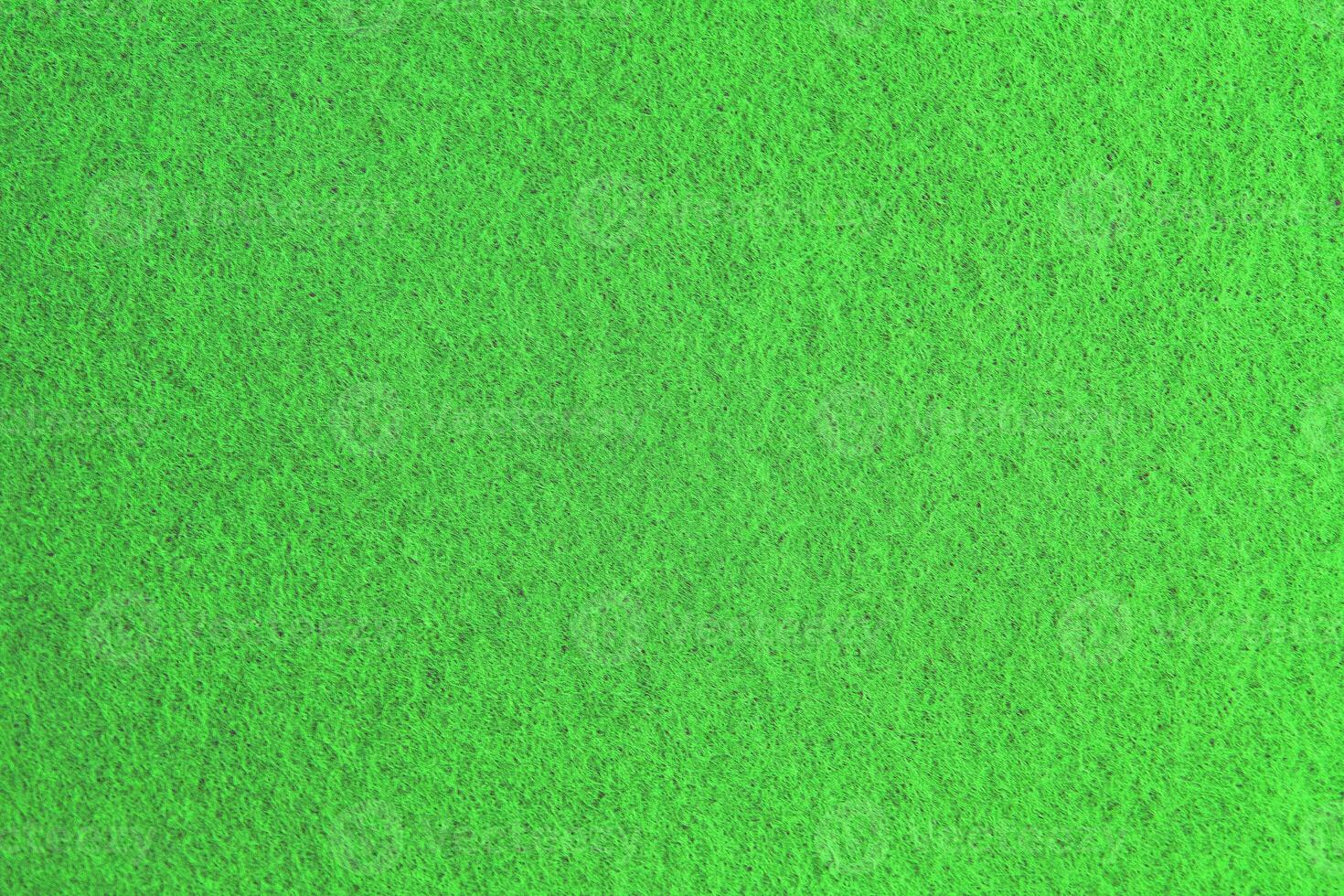 Green background pattern and texture of colored felt board. photo