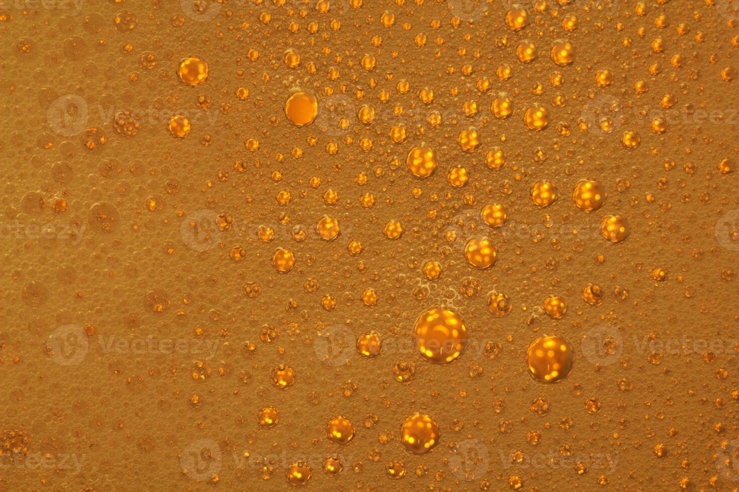Cooking oil, water with oil emulsions and bubbles in the background. photo
