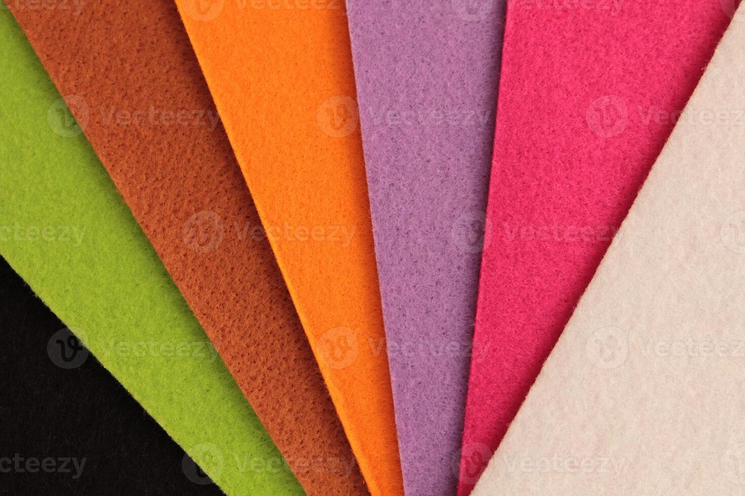 Colorful background pattern and texture of colored felt board. photo