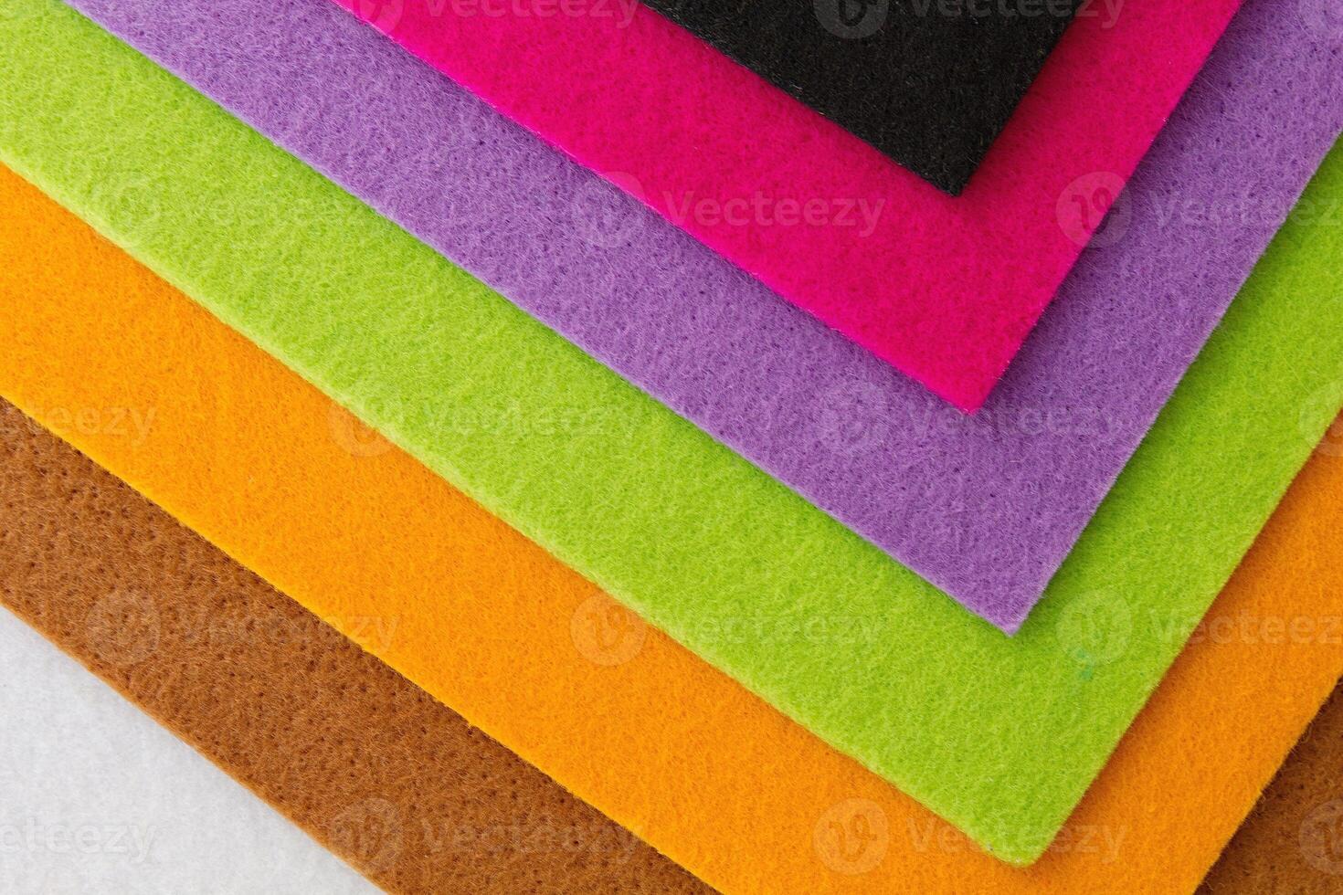 Colorful background pattern and texture of colored felt board. photo