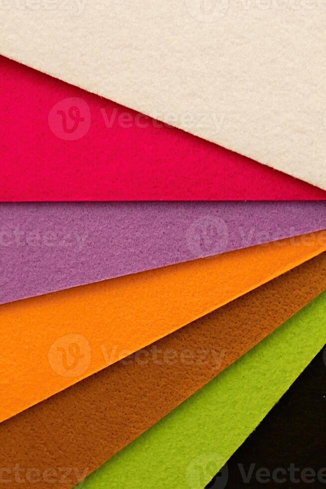 Colorful background pattern and texture of colored felt board. photo