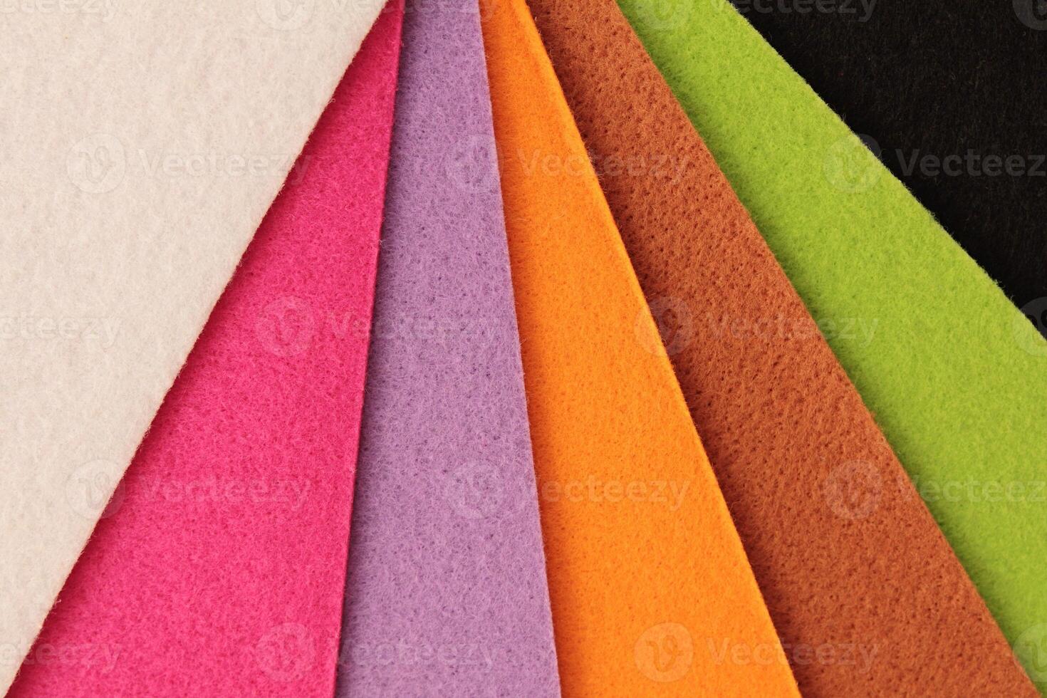 Colorful background pattern and texture of colored felt board. photo