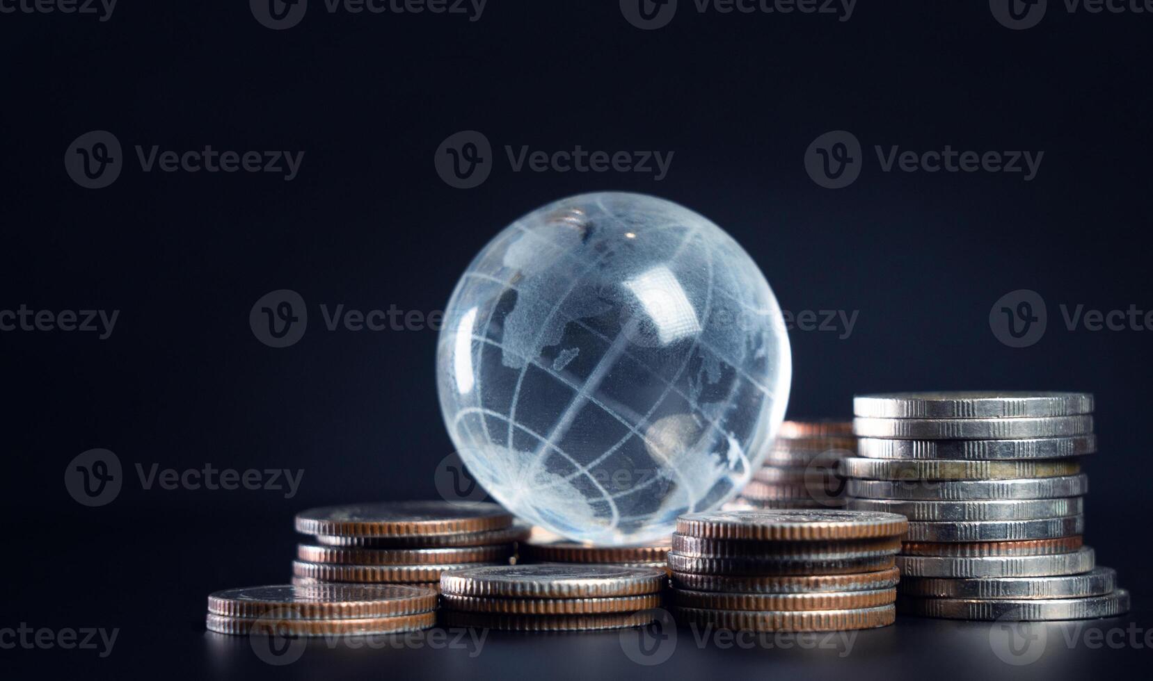 Global Economy Concept with Coins and Globe photo