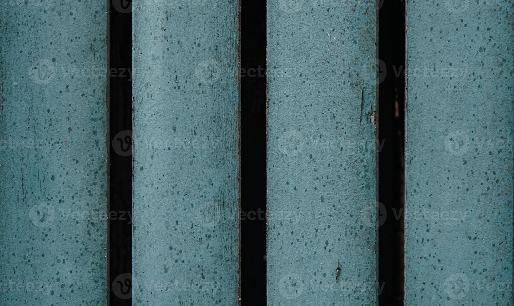 a close up of a blue bench with a black line photo