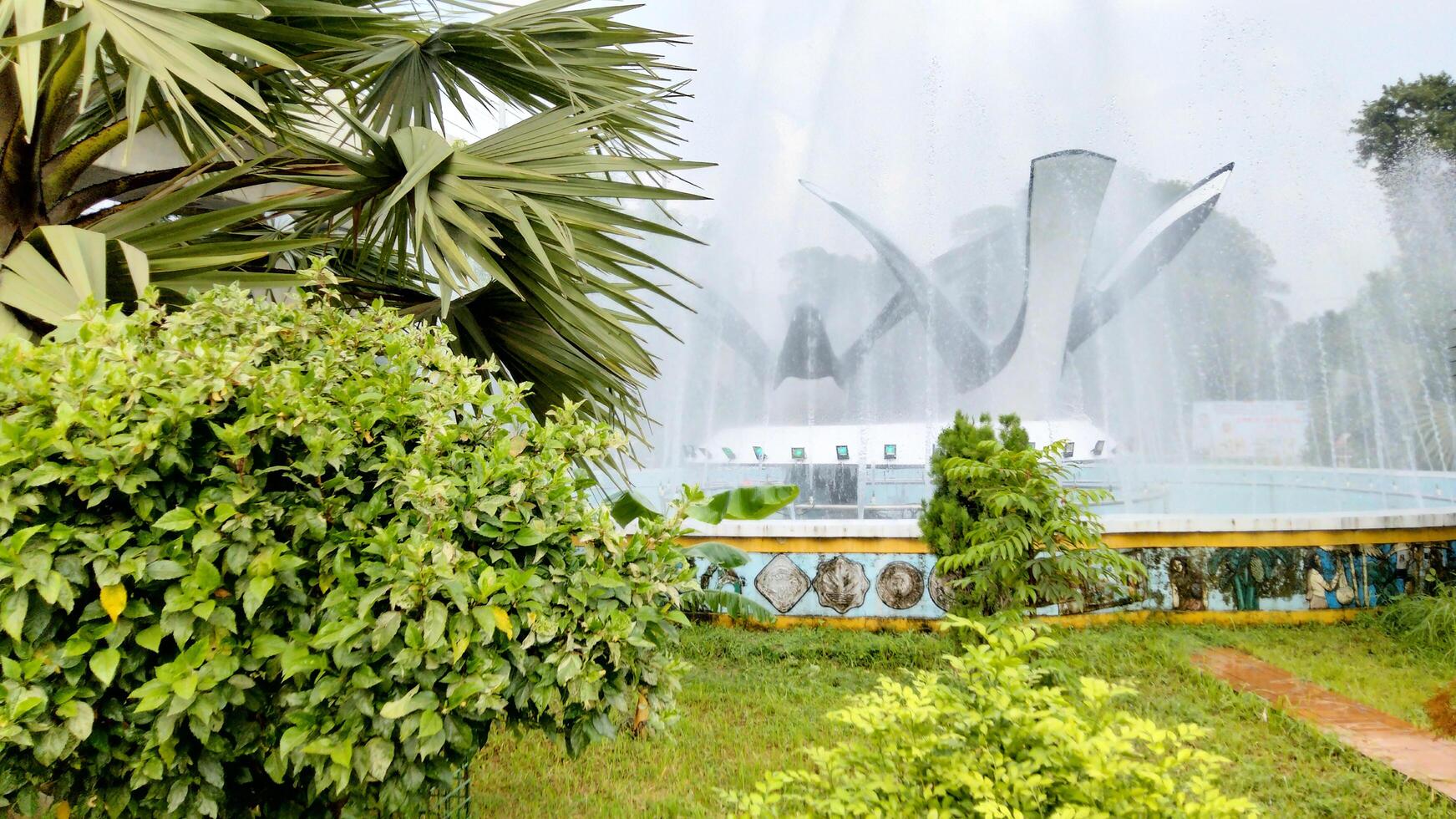 Splashing fountain in public park in City photo