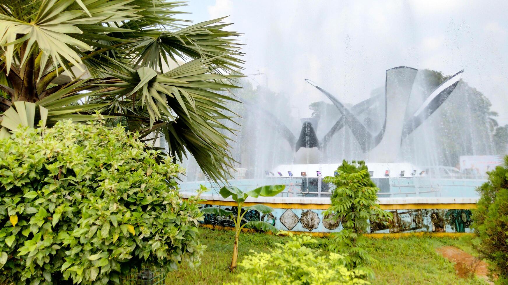 Splashing fountain in public park in City photo