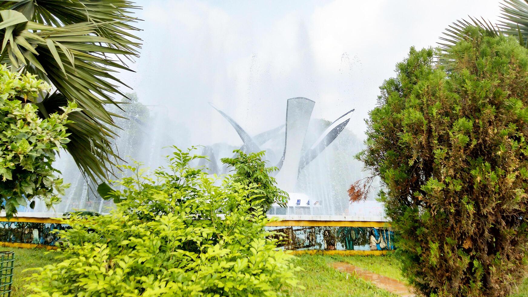 Splashing fountain in public park in City photo