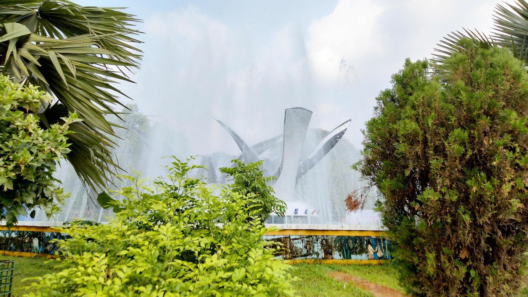 Splashing fountain in public park in City photo