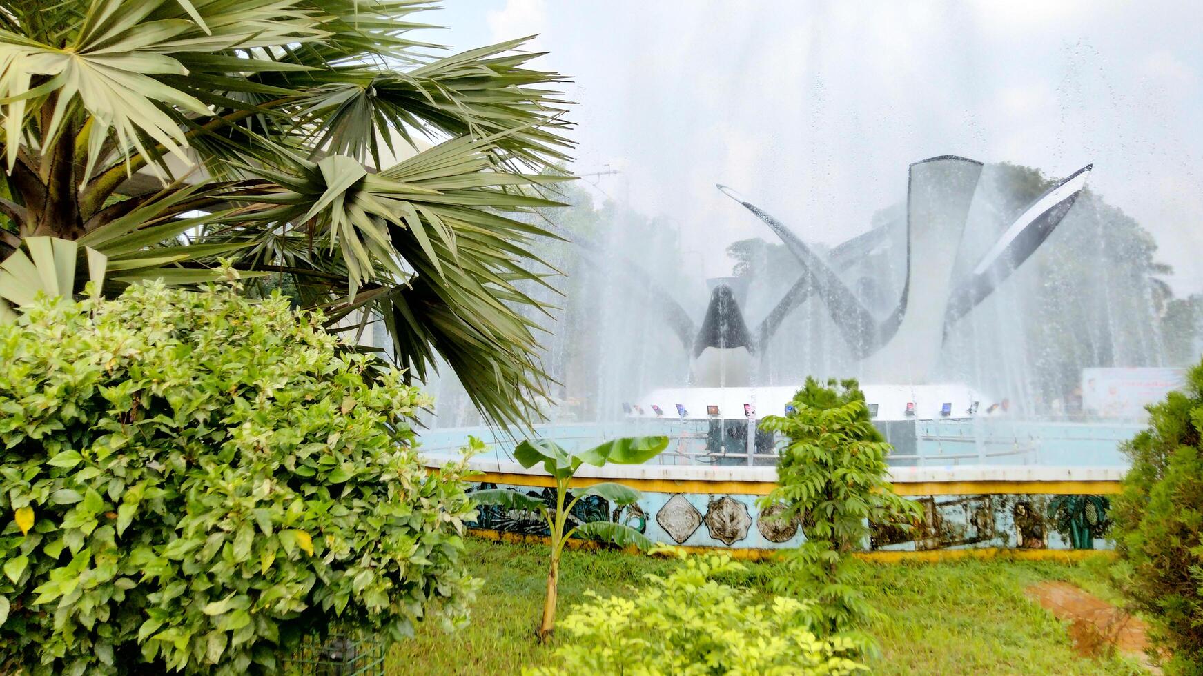 Splashing fountain in public park in City photo