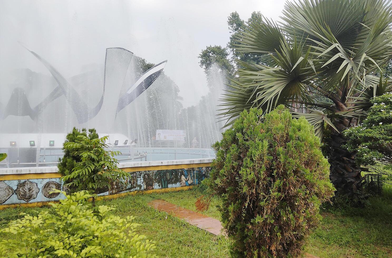 Splashing fountain in public park in City photo