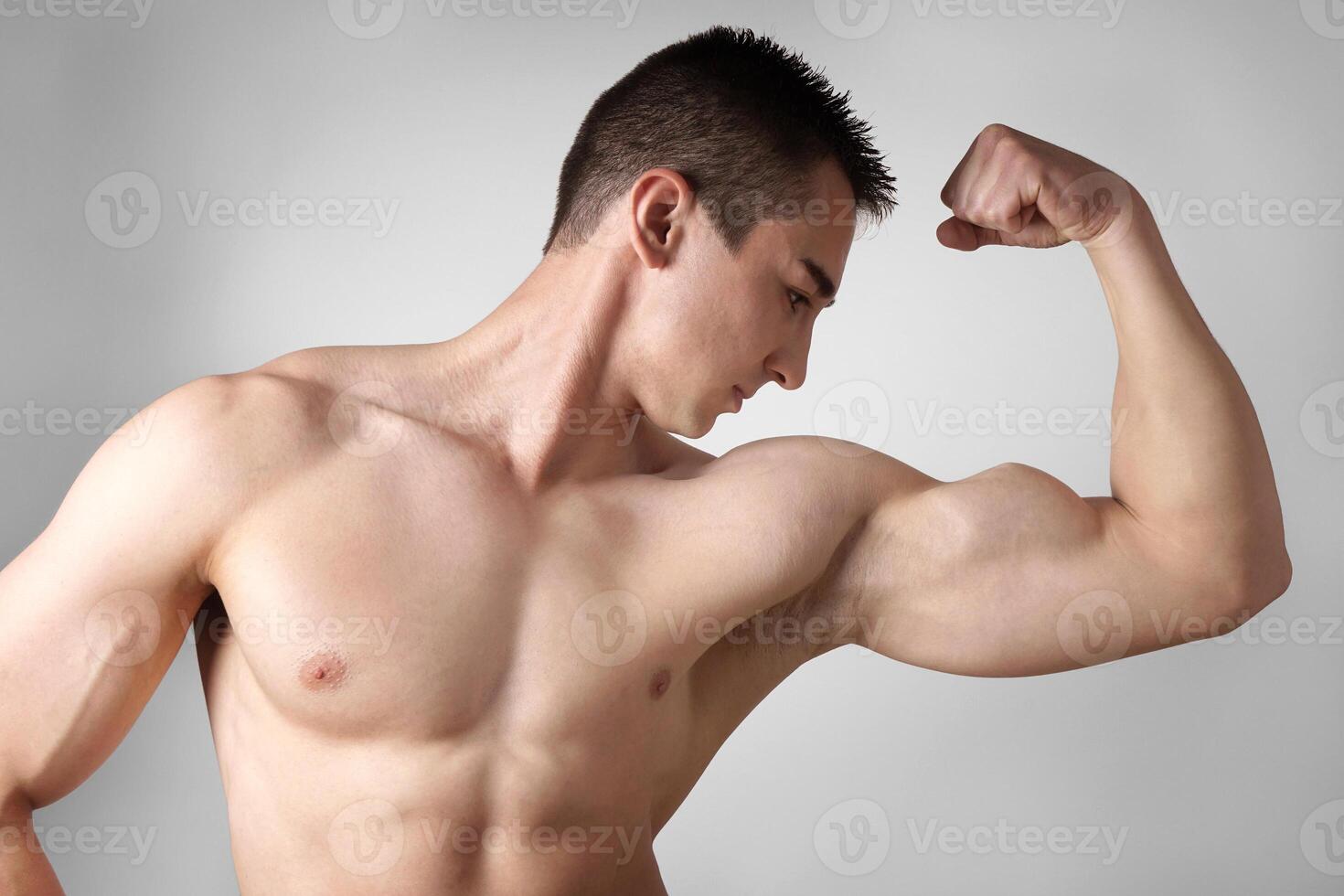 flexing-muscle-stock-photos-images-and-backgrounds-for-free-download