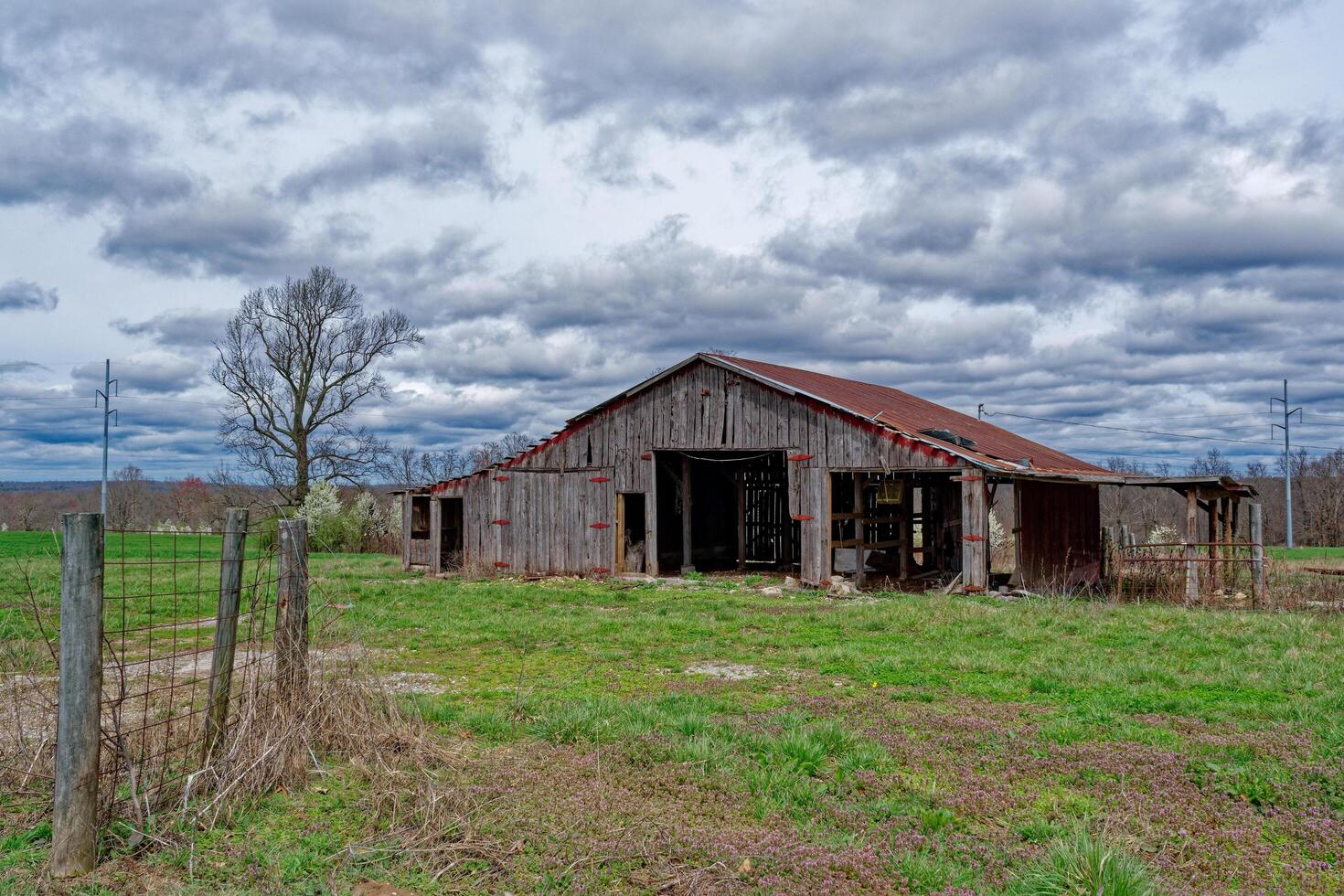 Abandoned barn and farmland photo