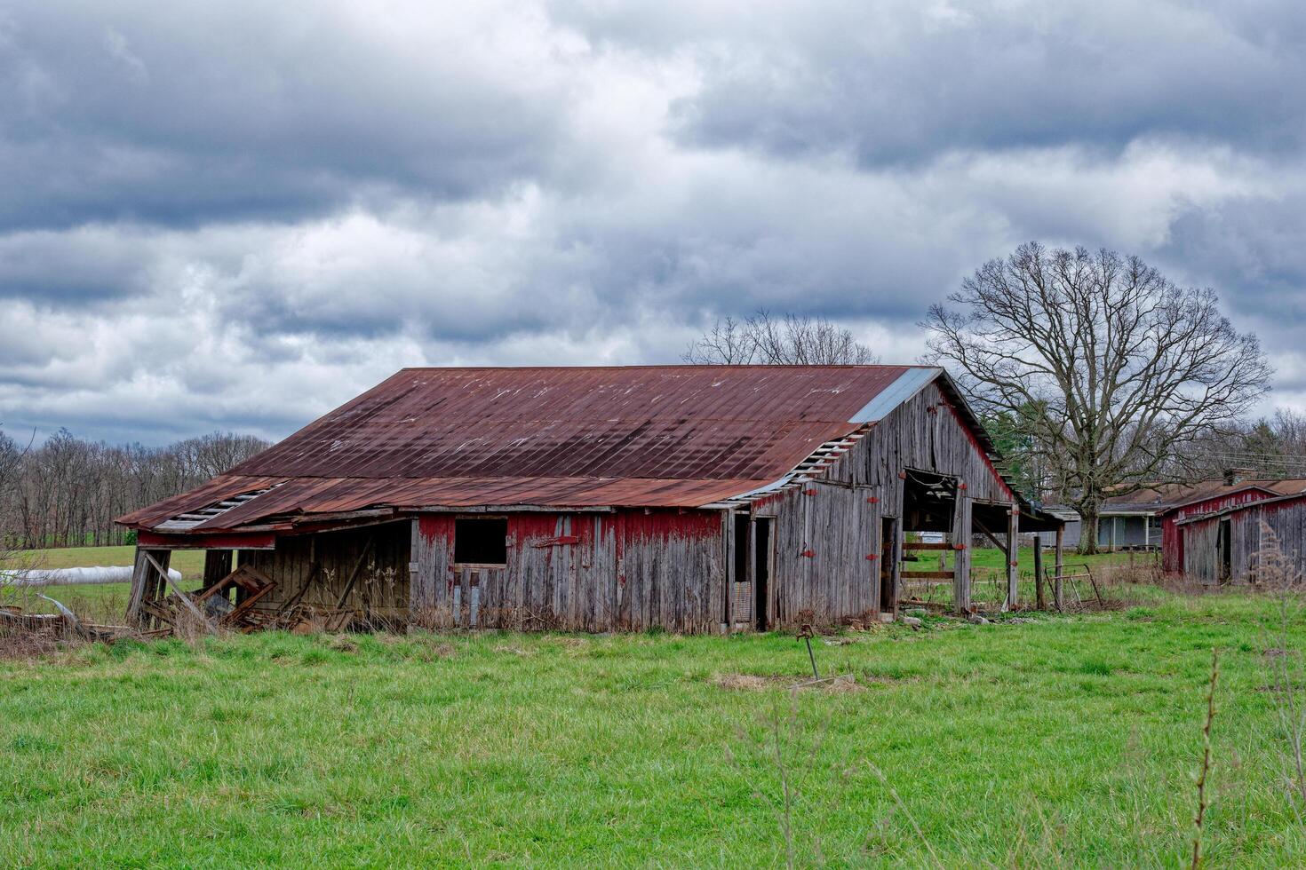 Abandoned rustic red barn photo